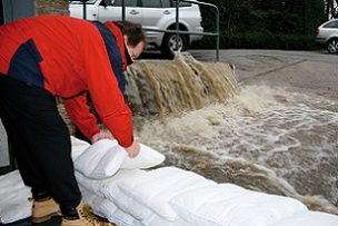 FloodSax sandless sandbags holding back a torrent of floodwater