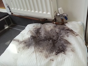 Water leaking from a radiator onto a FloodSax