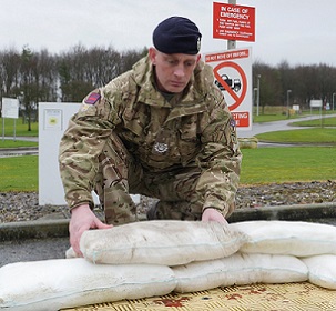 A soldier deploying FloodSax alternative sandbags